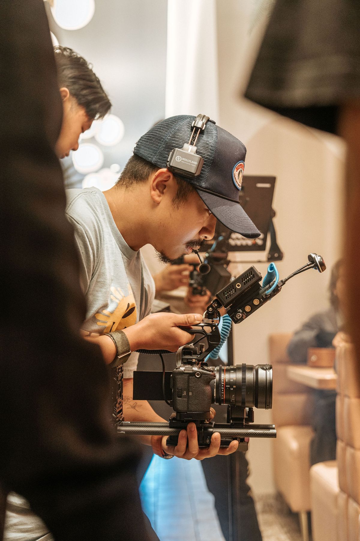 A photographer carrying a camera