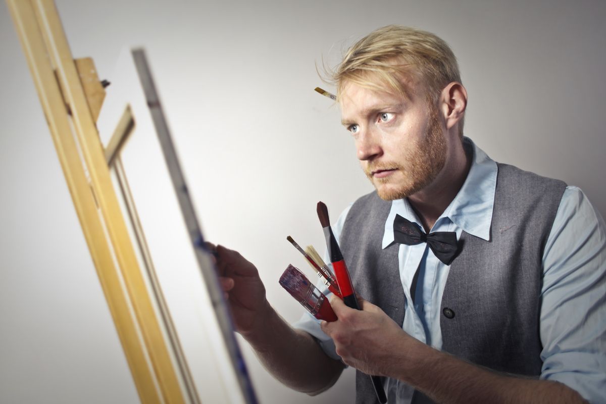 An artist working at an easel